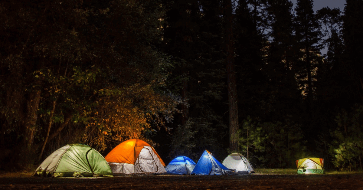 different tents lit up at night