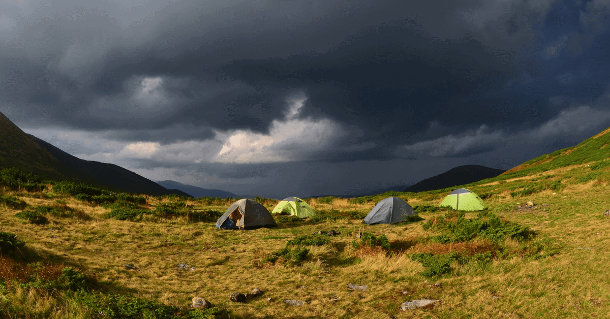 several tents under dark grey skies