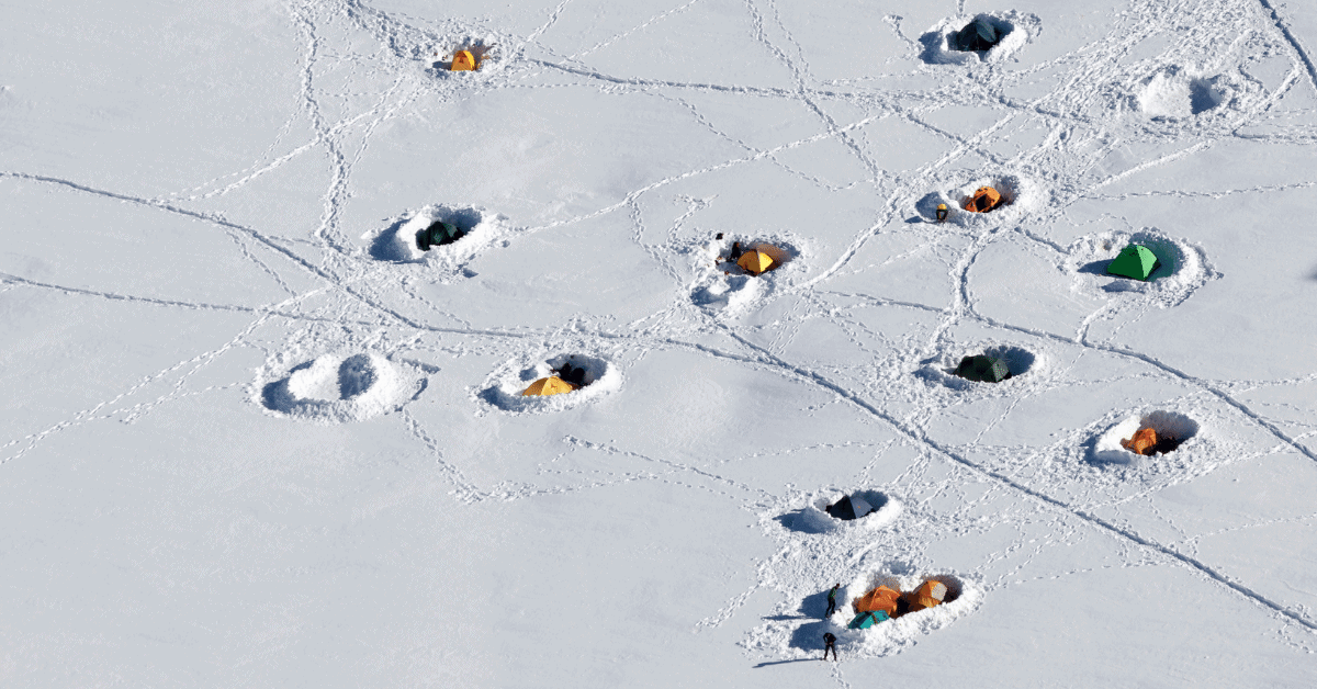 tents buried in the snow