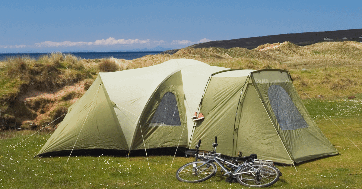 a family camping tent with a bike in front