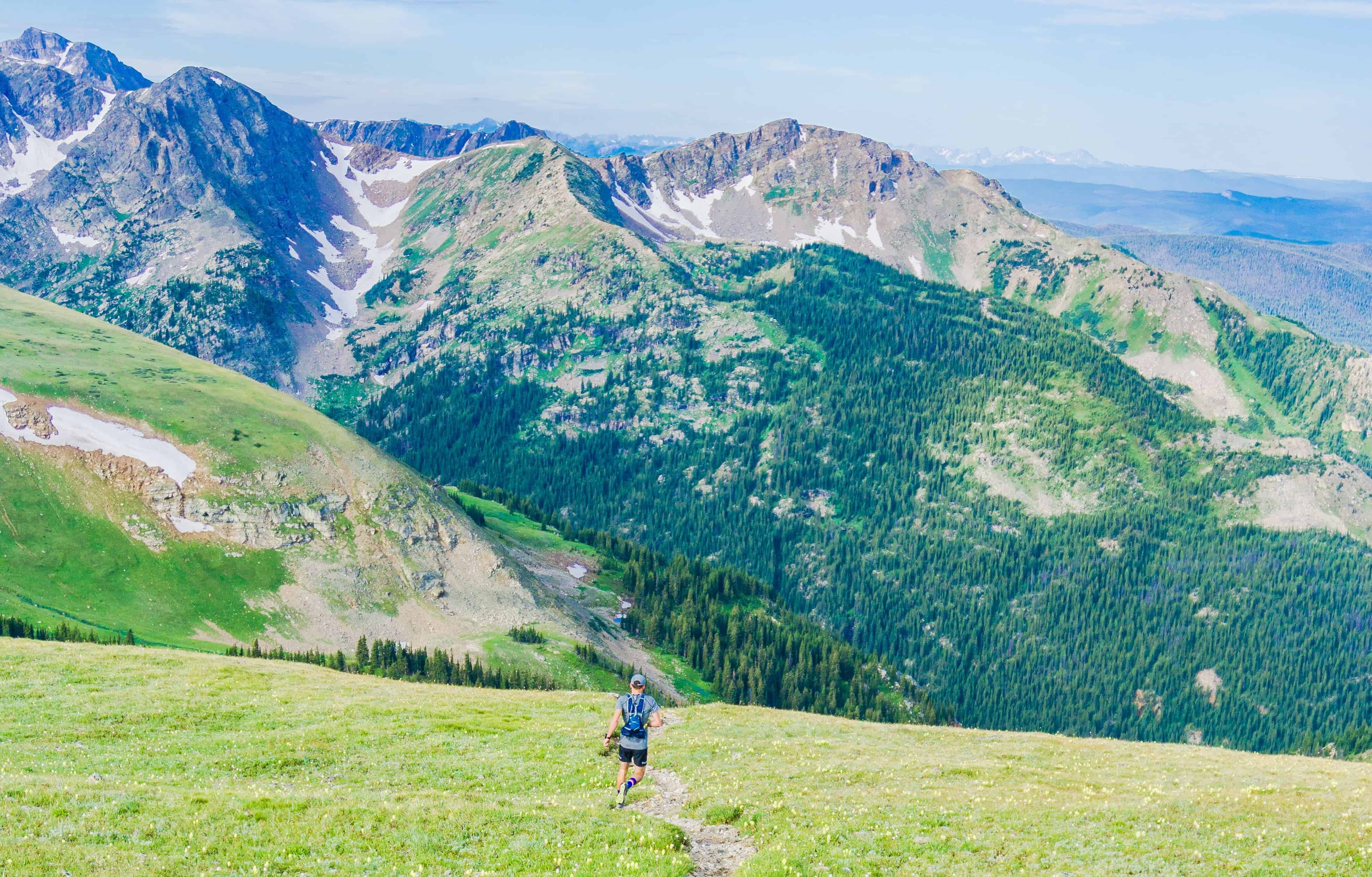 a guy running in the mountains