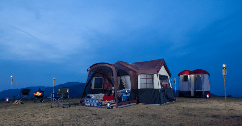 a large 3 room tent at night