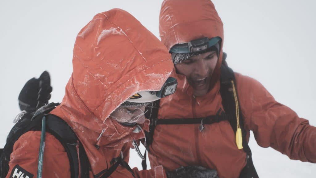 two people on a mountain summit