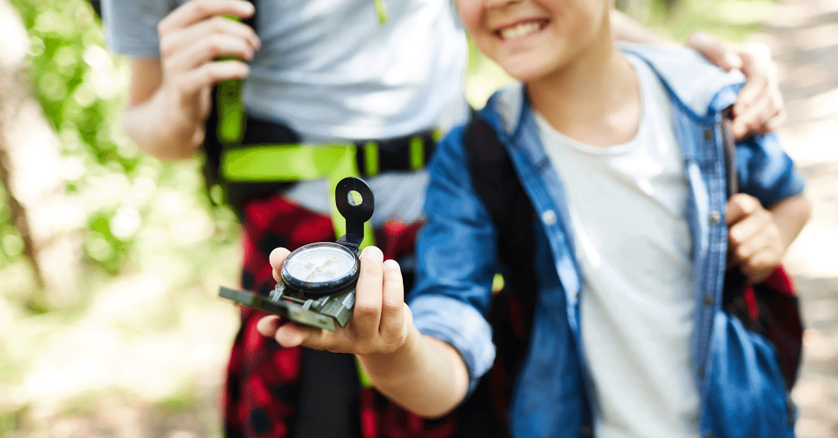 girl holding a compass