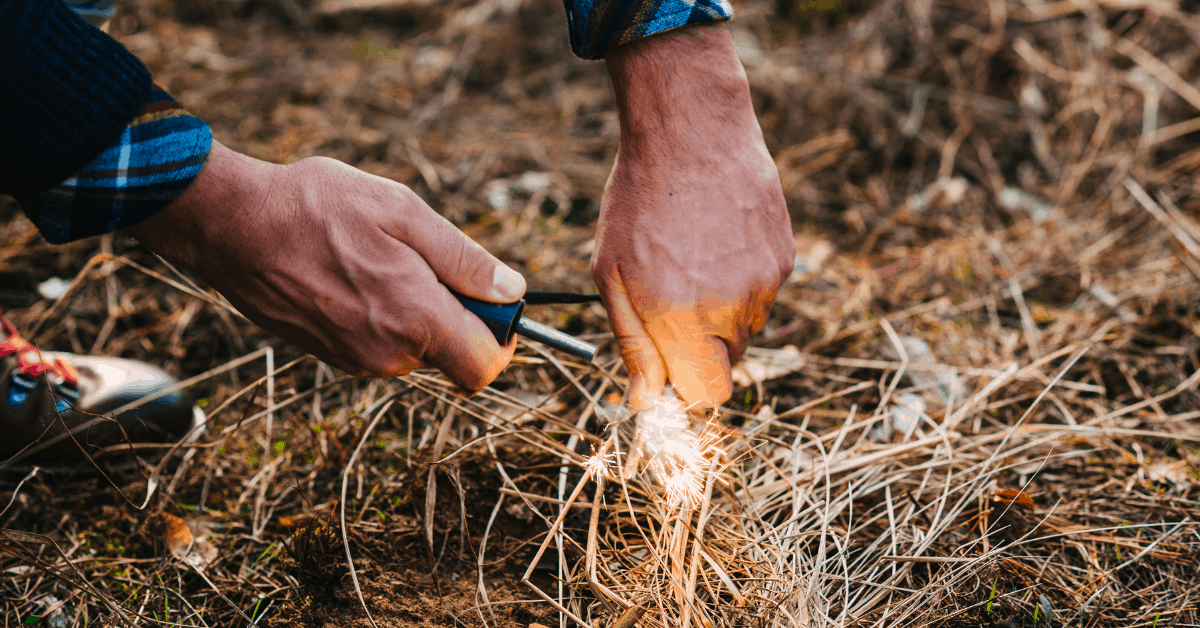 striking the flint with a fire starter