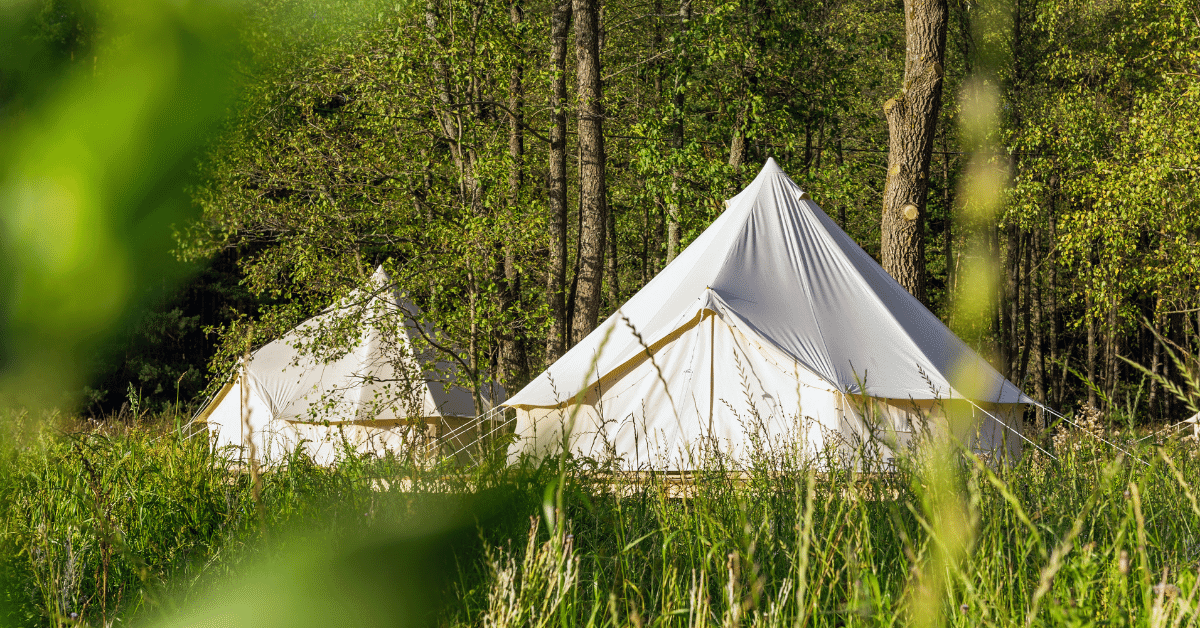 bell tents in a grassy setting