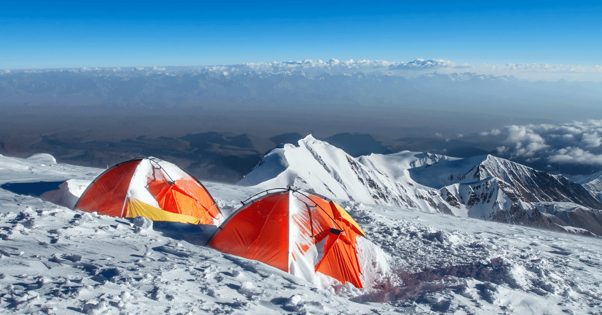 2 tents in the snow in the mountains