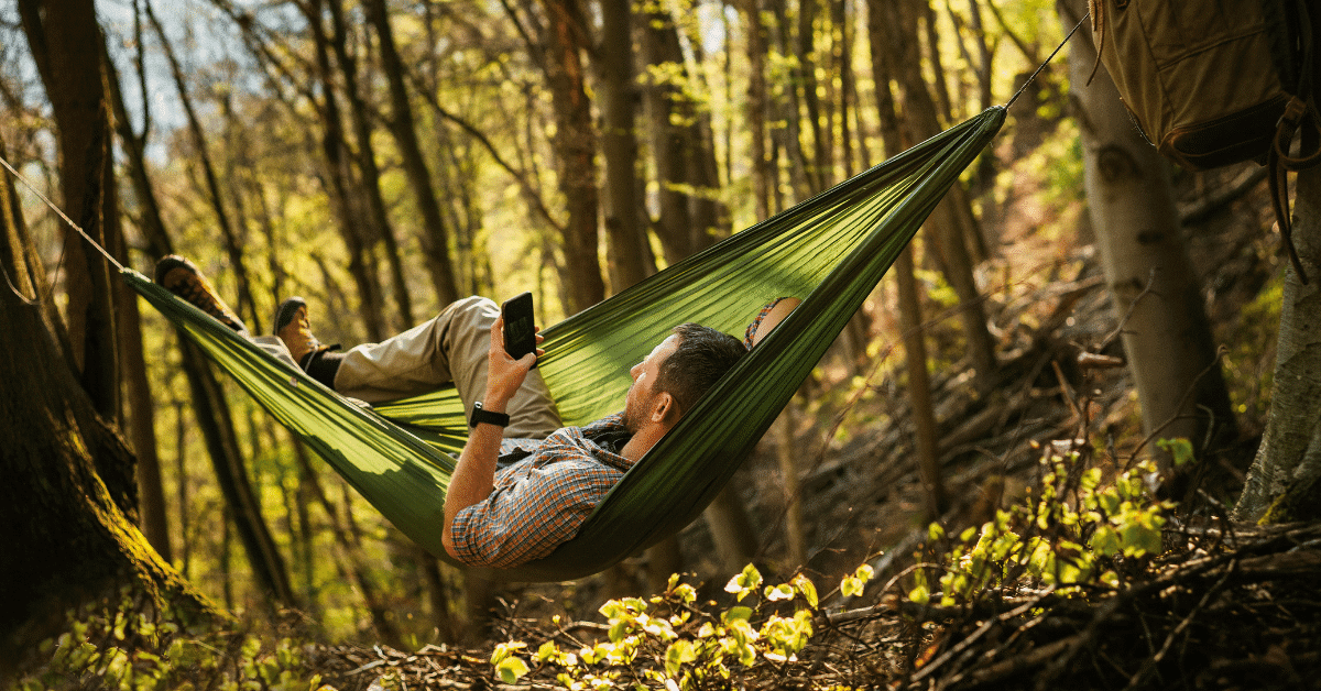 a man relaxing in a hammock