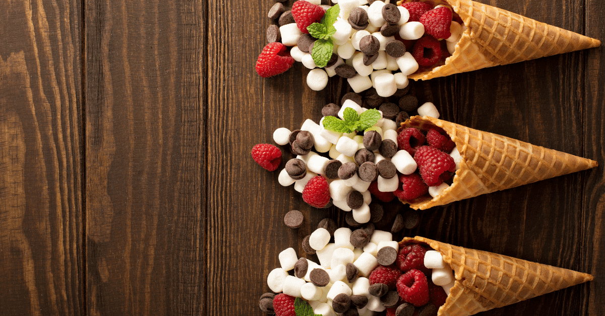 waffle cones filled with mini marshmallows chocolate chips and raspberries