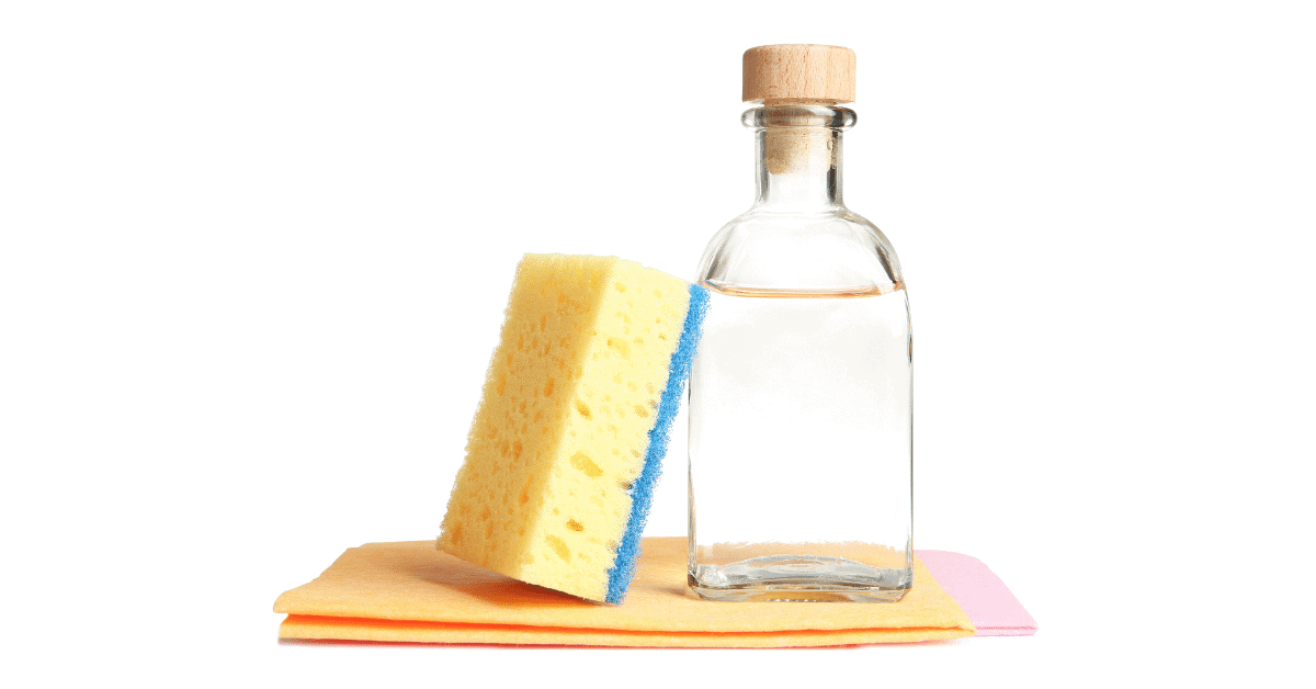 a bottle of distilled white vinegar and a cleaning sponge