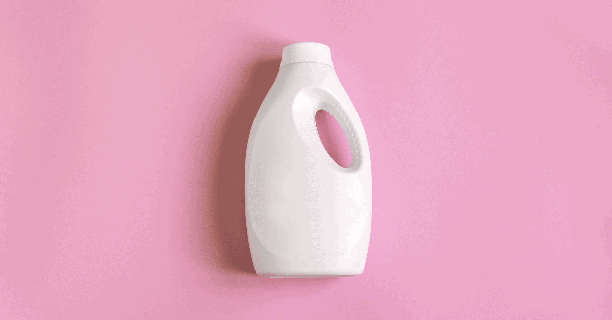 a cleaning product bottle on a pink background