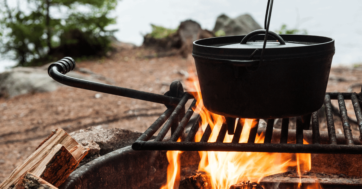 a dutch oven on a campfire