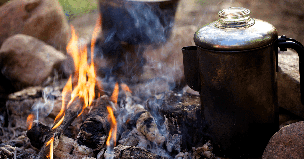 a kettle on a campfire