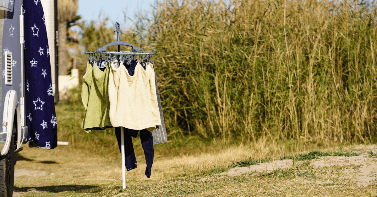 clothes hanging off a line at a campsite