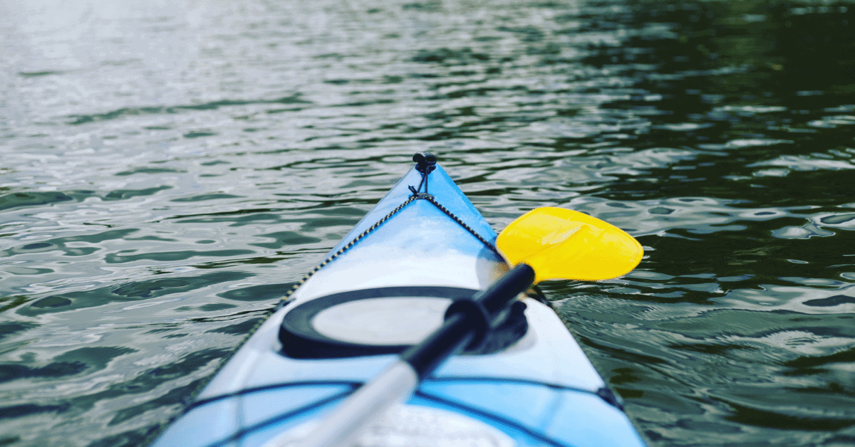 the front of a kayak in the water