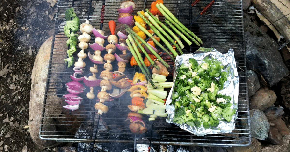 veggies grilling over a campfire