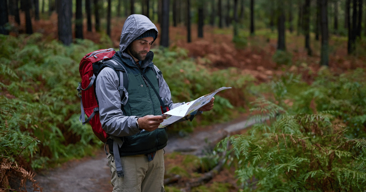 hiker looking at a map