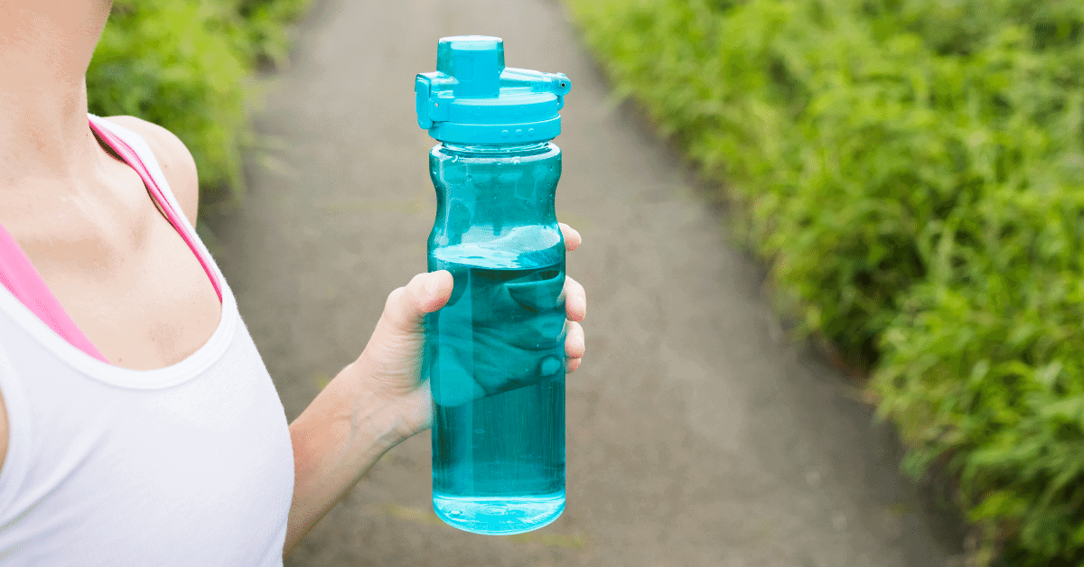 person holding a blue water bottle