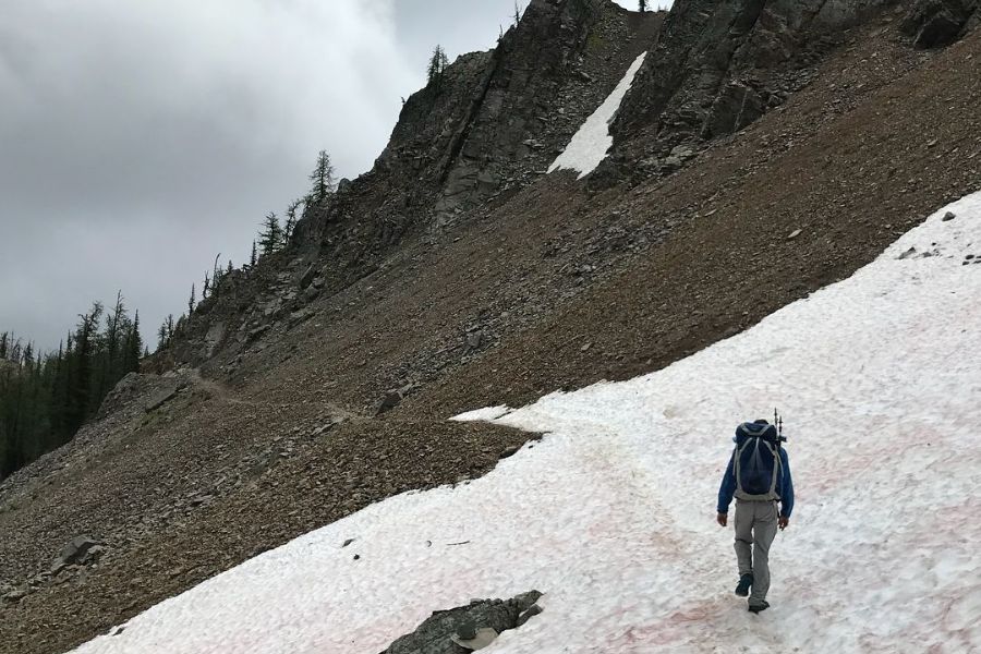 man hiking in snow