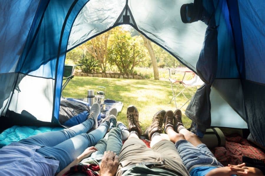 family lounging in a 6 person tent