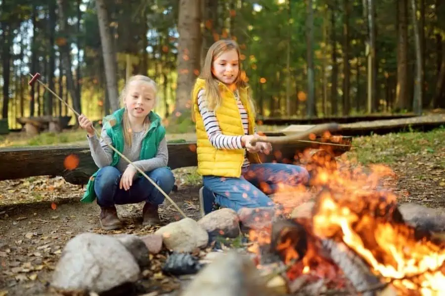 Kids sitting around a campfire