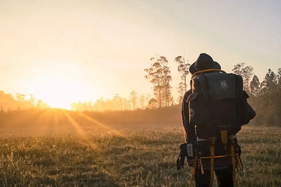 Backpacker in Field