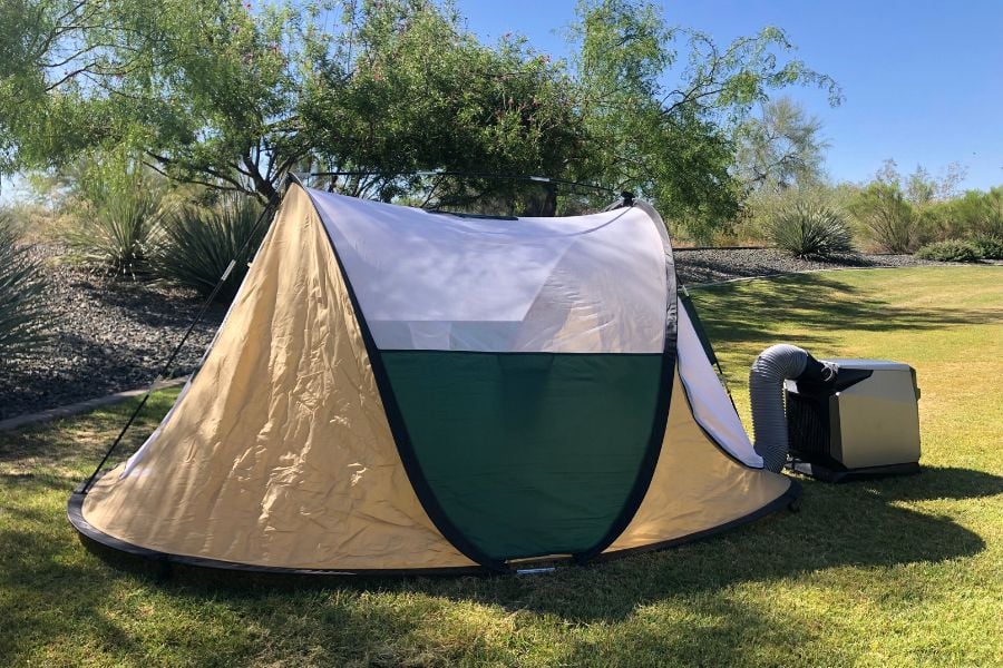 A pop up tent with a tent air conditioner