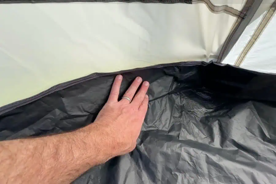 The 115D polyester floor is meaningfully thicker than the 75D floors common at this price point