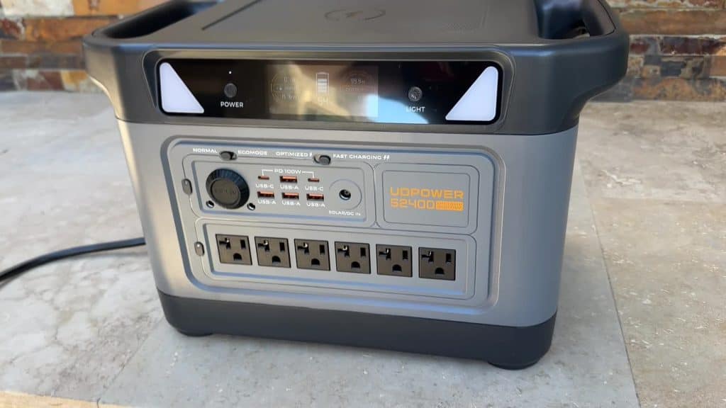 UDPower S2400 portable power station front view showing LCD display, fast charging mode switches, and full output port array